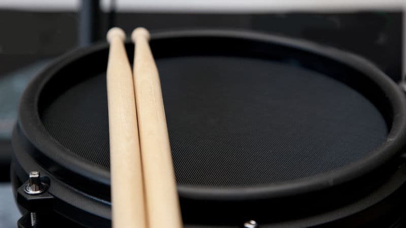 Rubber trigger pad and drum sticks