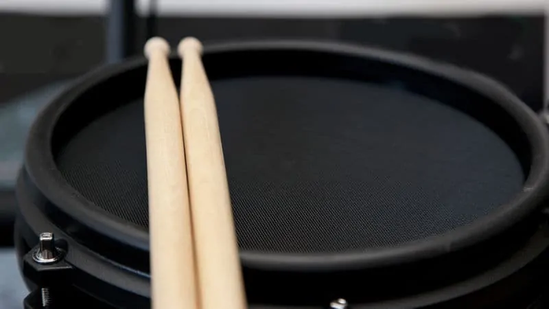 Rubber trigger pad and drum sticks